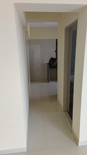 Living Room in 2 BHK Apartment at Romell Shraddha, Borivali West – for Rent