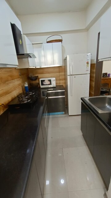 Kitchen in 2 BHK Apartment at Aditya Urban Casa, Sector 78 – for Rent