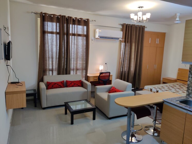 Living Room, supertech-czar-suites Studio 545 Sq.Ft. Apartment In Omicron I Greater Noida Greater Noida 8910438