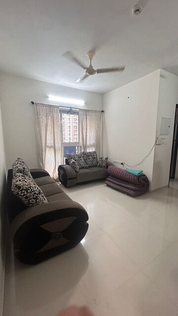 Living Room in 1 BHK Apartment at Lodha Amara, Kolshet Road – for Sale