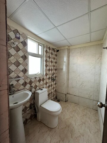 Bathroom in 1 BHK Apartment at Eureka Diya Green City, Raj Nagar Extension – for Rent