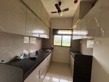 Kitchen in 2 BHK Apartment at KM Horizon Exotica, Haware City – for Rent