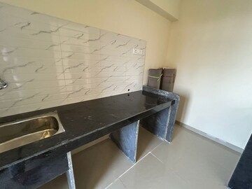 Kitchen in 2 BHK Apartment at Pushpanjali Heights, Owale – for Rent