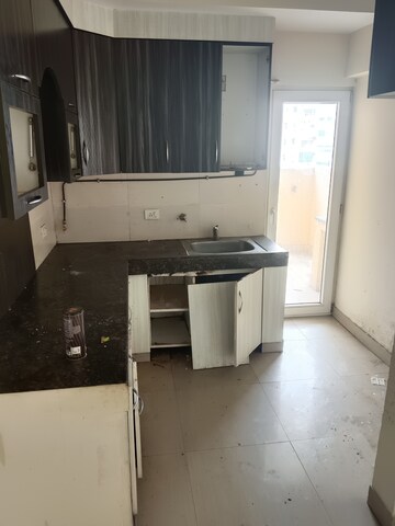 Kitchen in 3 BHK Apartment at Paramount Floraville, Sector 137 – for Sale