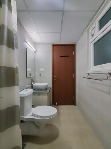 Bathroom in 3 BHK Apartment at Bhartiya Nikoo Homes Phase 2, Thanisandra Main Road – for Rent