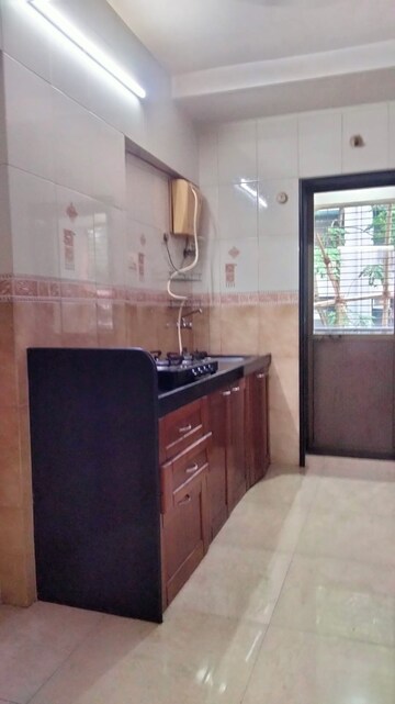 Kitchen in 2.5 BHK Apartment at Radha Govind, Borivali East – for Rent