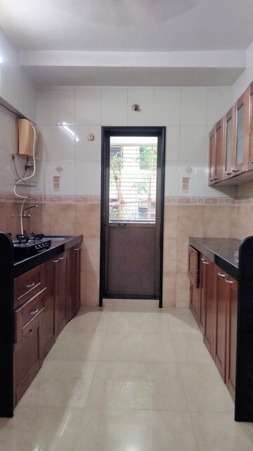 Kitchen in 2.5 BHK Apartment at Radha Govind, Borivali East – for Rent