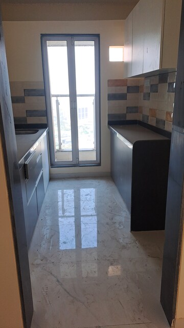 Kitchen in 1 BHK Apartment at DSS Mahavir Kalpavruksha Alcacia Tower, Ghodbunder Road – for Sale