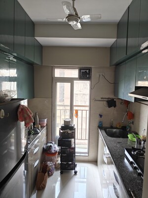 Kitchen in 1.5 BHK Apartment at Metropolis Aquaris Phase 2, Kasarvadavali – for Sale