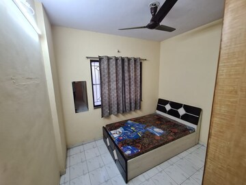 Bedroom in 2 BHK Apartment at Naiknavare Gardenia Society Phase 1, Wadgaon Sheri – for Rent