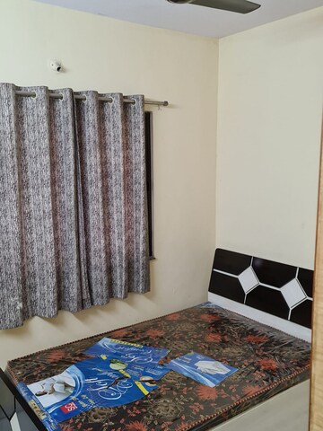 Bedroom in 2 BHK Apartment at Naiknavare Gardenia Society Phase 1, Wadgaon Sheri – for Rent