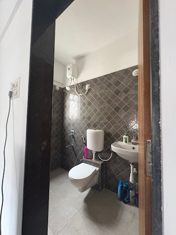 Bathroom in 2 BHK Apartment at Satyam Serenity, Wadgaon Sheri – for Rent