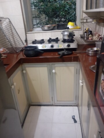 Kitchen in 1 BHK Apartment at White Rose CHS, Andheri East – for Sale