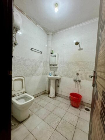 Bathroom in 2 BHK Builder Floor at Sharma Apartments Burari, Burari – for Rent