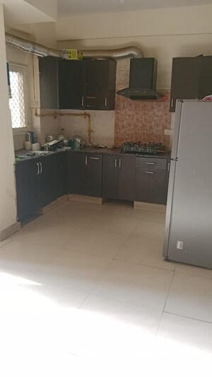 Kitchen in 2.5 BHK Apartment at Aims Golf City, Sector 75 – for Sale