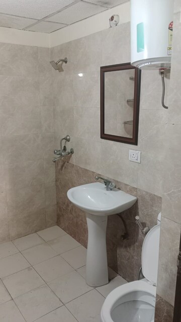 Bathroom in 2.5 BHK Apartment at Aims Golf City, Sector 75 – for Sale