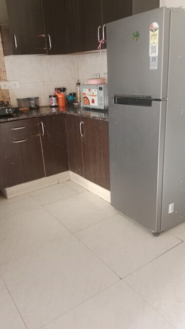 Kitchen in 2.5 BHK Apartment at Aims Golf City, Sector 75 – for Sale