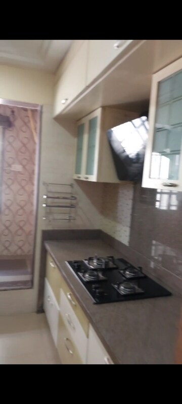 Kitchen in 3 BHK Apartment at Neelkanth Greens, Manpada – for Rent