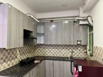 Kitchen in 2 BHK Apartment at Mahagun Mywoods, Sector 16c Greater Noida – for Rent