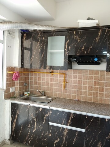 Kitchen in 3 BHK Apartment at Mahagun Mywoods, Sector 16c Greater Noida – for Rent