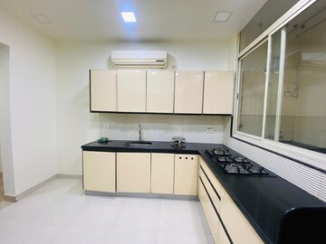 Kitchen in 4 BHK Apartment at Boat Club Road – for Sale
