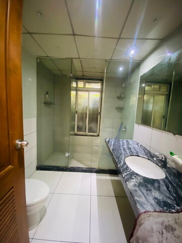 Bathroom in 4 BHK Apartment at Boat Club Road – for Sale