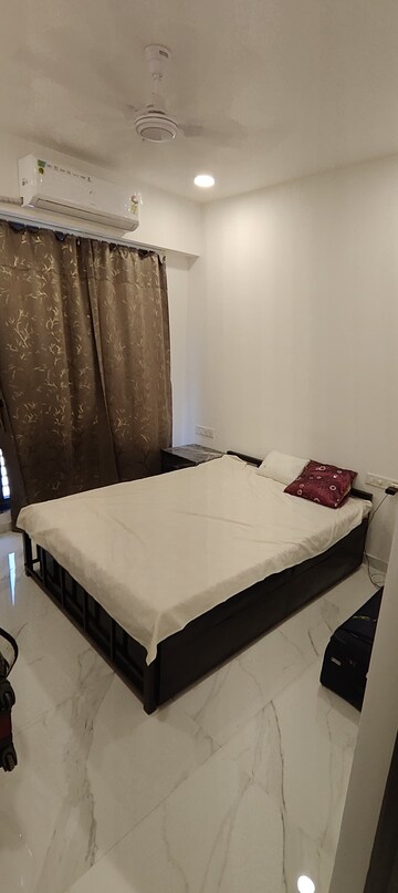 Bedroom in 2 BHK Apartment at Dev Leo Tower, Oshiwara – for Rent
