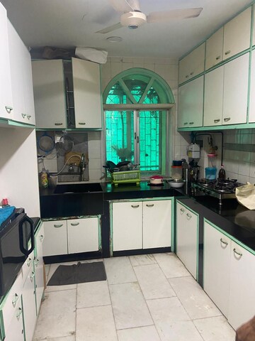 Kitchen in 2 BHK Apartment at Swan Lake Apartment, Khar West – for Rent