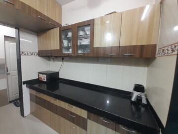 Kitchen in 2 BHK Apartment at Hubtown Greenwoods, Vartak Nagar – for Sale