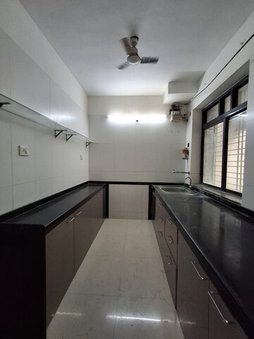 Kitchen in 2 BHK Apartment at Vasant Sagar, Kandivali East – for Sale