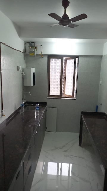 Kitchen in 2 BHK Apartment at Shapoorji Pallonji Alpine, Kandivali East – for Rent