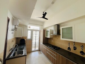 Kitchen in 3.5 BHK Apartment at Puri Emerald Bay, Sector 104 – for Sale