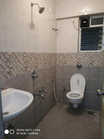 Bathroom in 2 BHK Apartment at Cosmos 27 Gbr, Kasarvadavali – for Rent