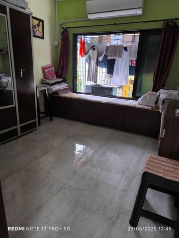 Living Room in 2 BHK Apartment at Ekdant CHS, Goregaon East – for Sale