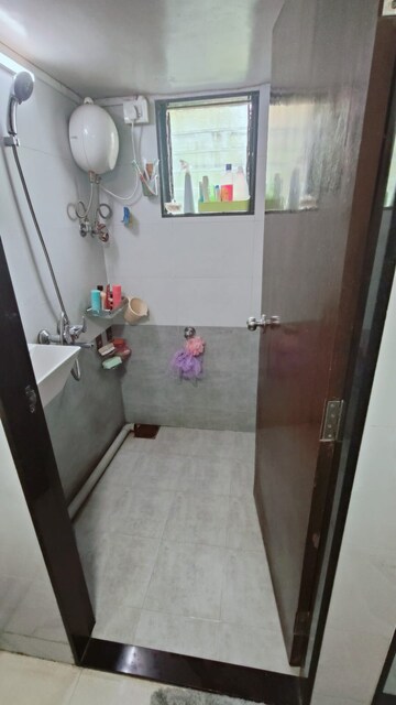 Bathroom in 1 BHK Apartment at Nagari Niwara CHS, Goregaon East – for Sale