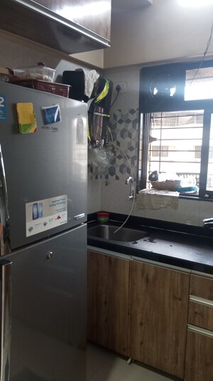 Kitchen in 1 BHK Apartment at Raunak Unnathi Woods Phase 7 A And B, Ghodbunder Road – for Sale