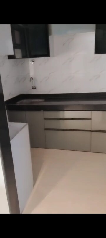Kitchen in 1 BHK Apartment at Nirmaan Shivneri CHS, Andheri West – for Sale