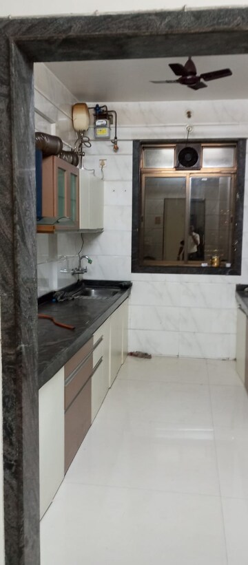 Kitchen in 4 BHK Apartment at Safal Nav Parmanu CHS, Chembur – for Rent