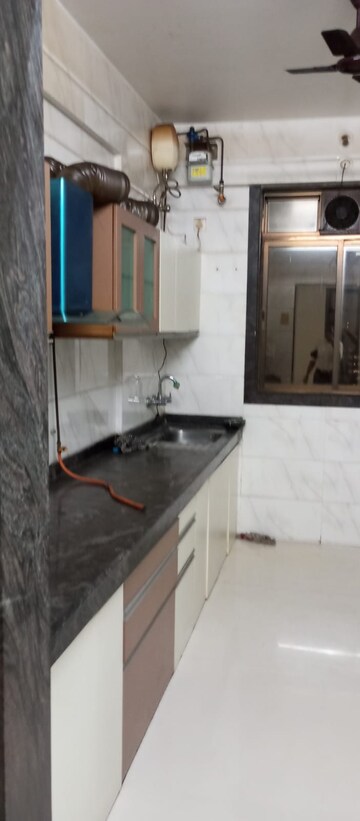 Kitchen in 4 BHK Apartment at Safal Nav Parmanu CHS, Chembur – for Rent