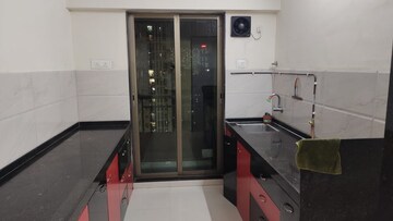 Kitchen in 2 BHK Apartment at Cosmos Lounge, Manpada – for Rent