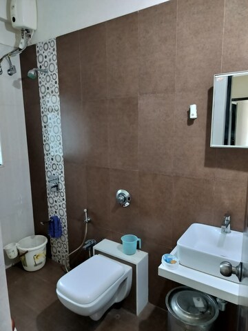 Bathroom in 1 BHK Apartment at Raunak Heights, Ghodbunder Road – for Rent
