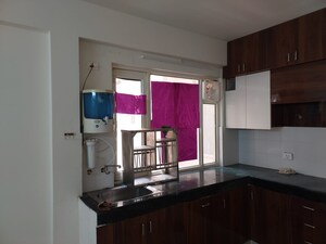 Kitchen in 2 BHK Apartment at ROF Aalayas, Sector 102 – for Sale