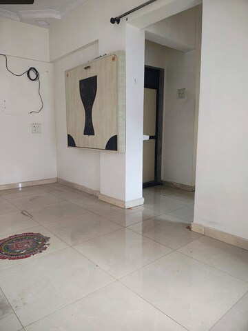 Living Room in 1 BHK Apartment at Bhumiraj Woods, Kharghar – for Sale