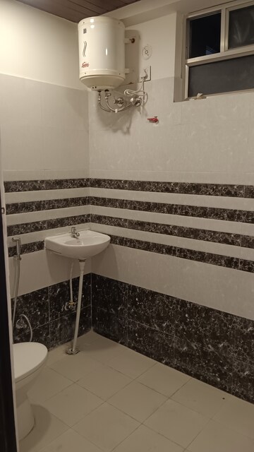 Bathroom in 3 BHK Apartment at Mansarovar Extension – for Rent