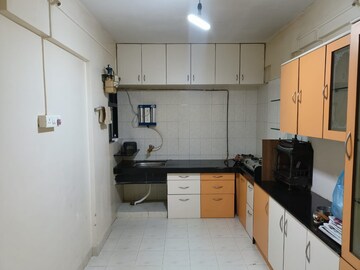 Kitchen in 2 BHK Apartment at Kanchanban Apartments, Kothrud – for Rent