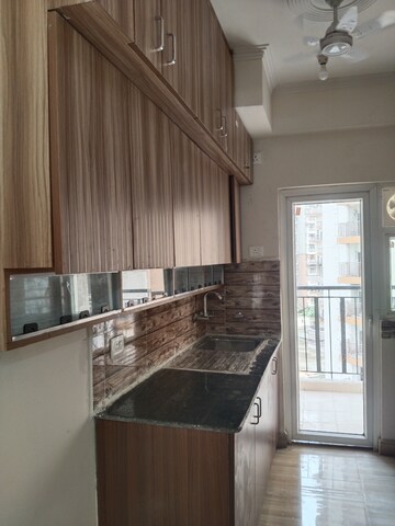 Kitchen in 3 BHK Apartment at Amrapali Tropical Garden, Tech Zone 4 Greater Noida – for Rent