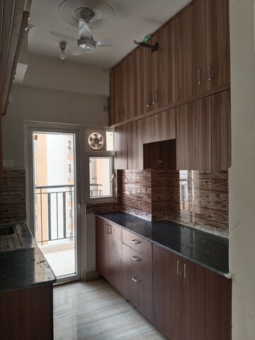 Kitchen in 3 BHK Apartment at Amrapali Tropical Garden, Tech Zone 4 Greater Noida – for Rent