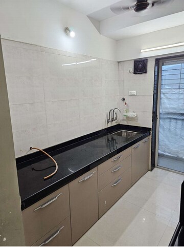 Kitchen in 1 BHK Apartment at Uma Elements, Daighar Gaon – for Rent