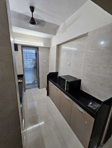 Kitchen in 1 BHK Apartment at Uma Elements, Daighar Gaon – for Rent