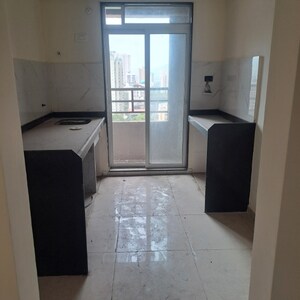 Kitchen in 2 BHK Apartment at Mahavir Kalpavruksha, Ghodbunder Road – for Sale